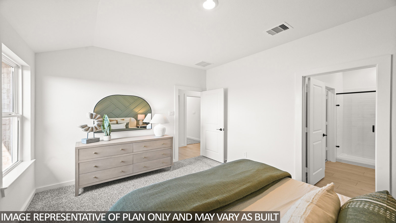 Secondary bedroom with carpet flooring