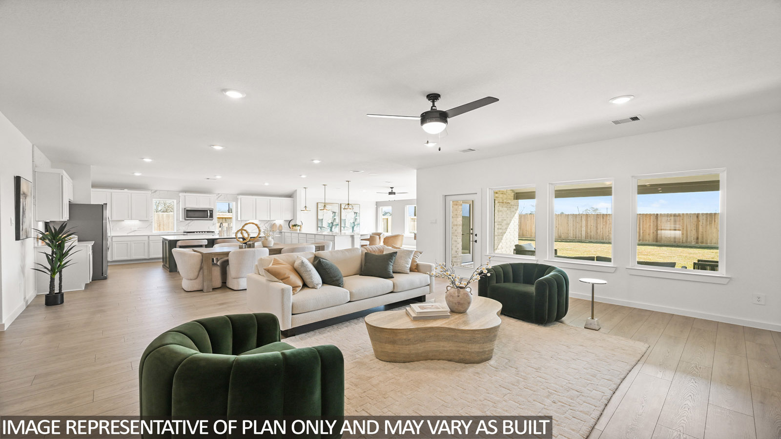 Spacious living area with vinyl flooring