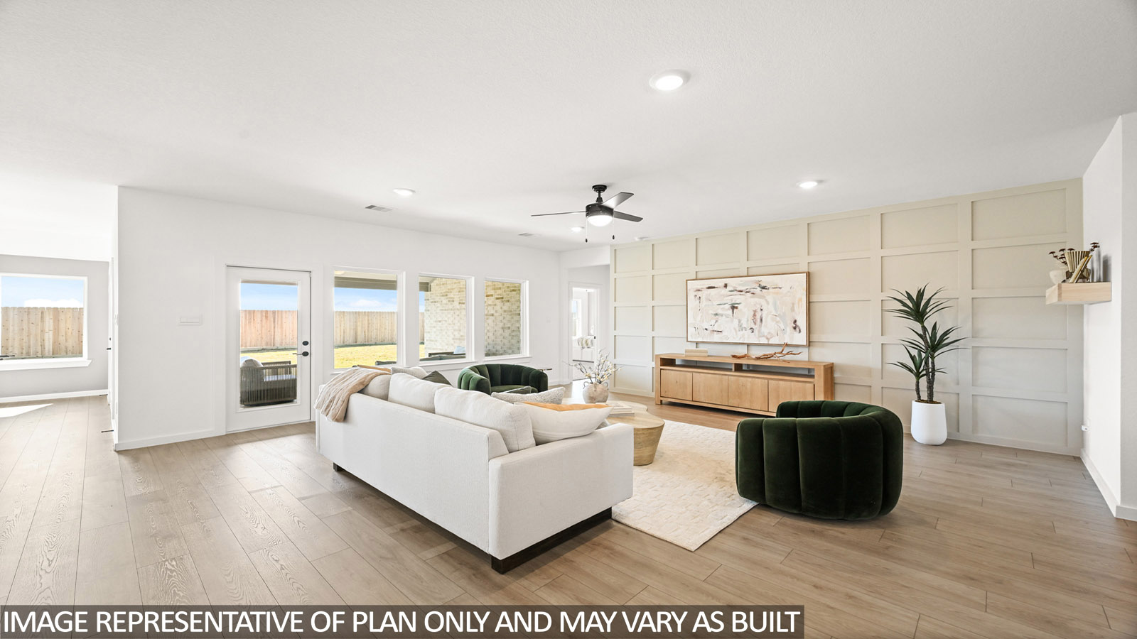 Spacious living area with vinyl flooring
