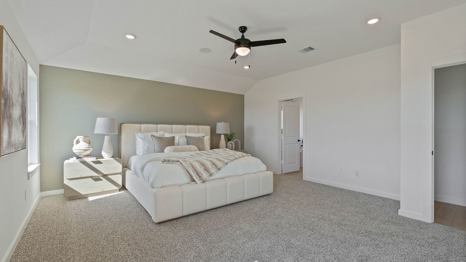 primary bedroom with bright windows