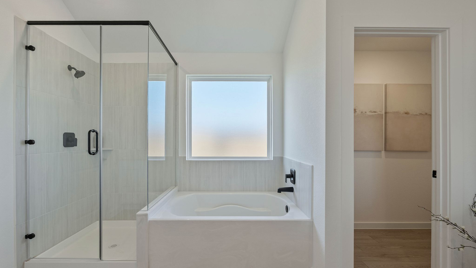 primary bedroom with tub and shower