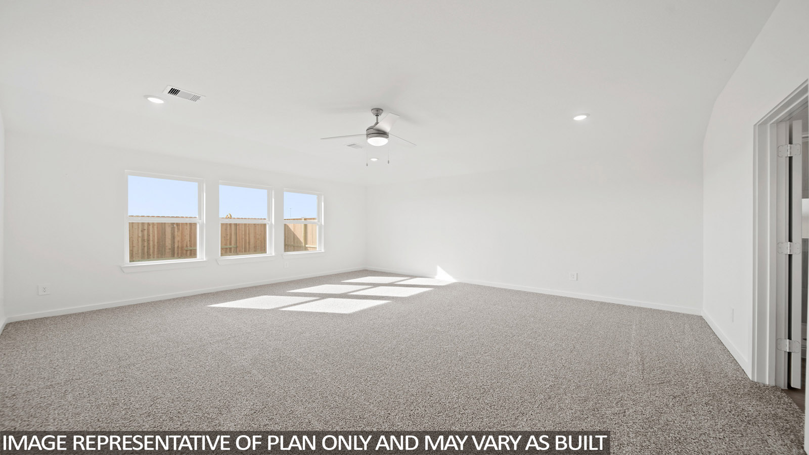 Primary bedroom with carpet flooring