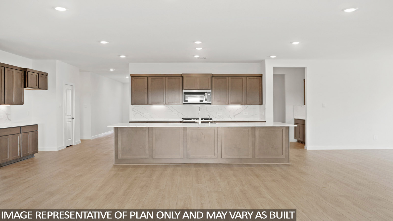 Kitchen with an island and vinyl floor
