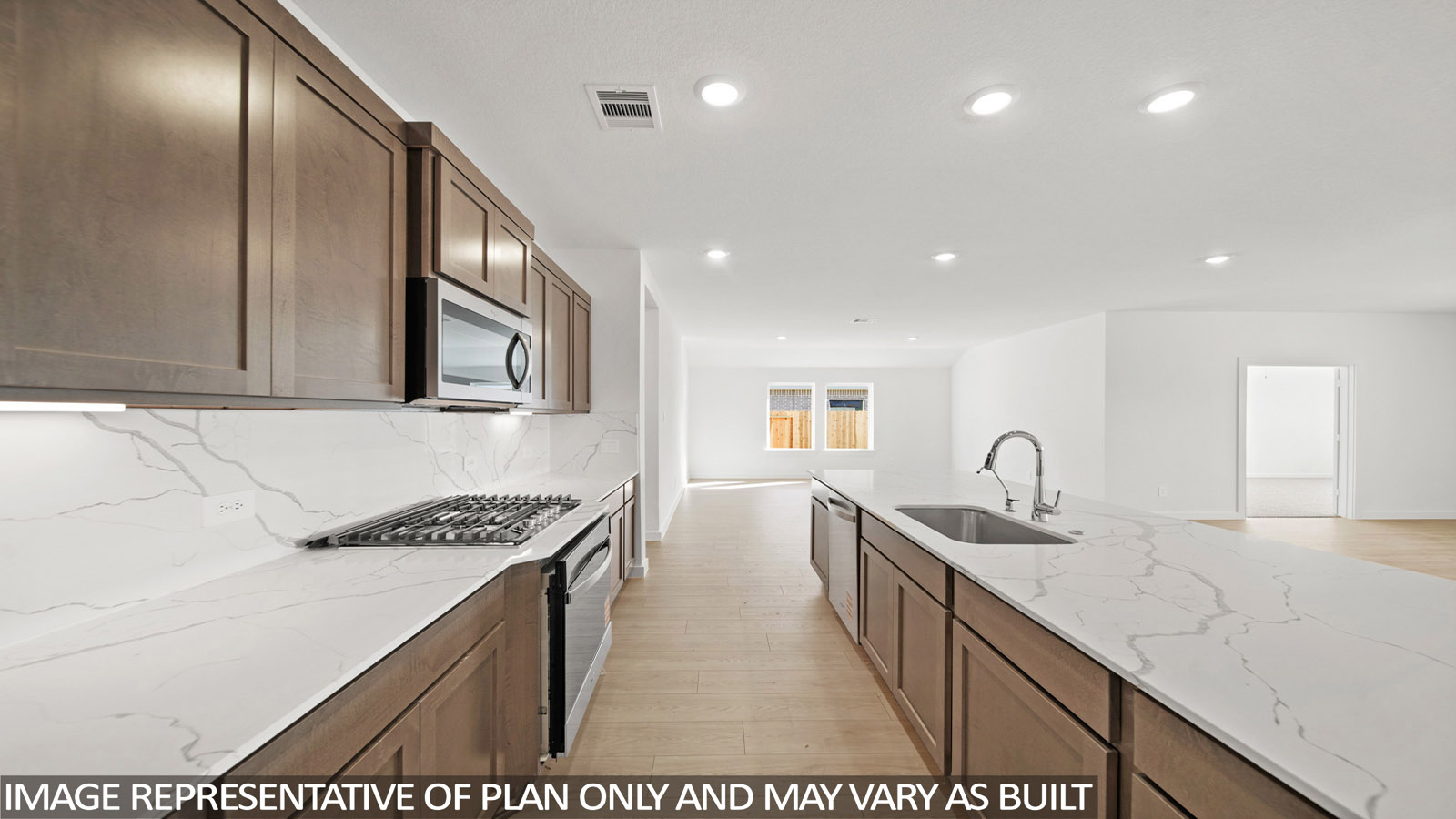 Kitchen with an island and vinyl floor