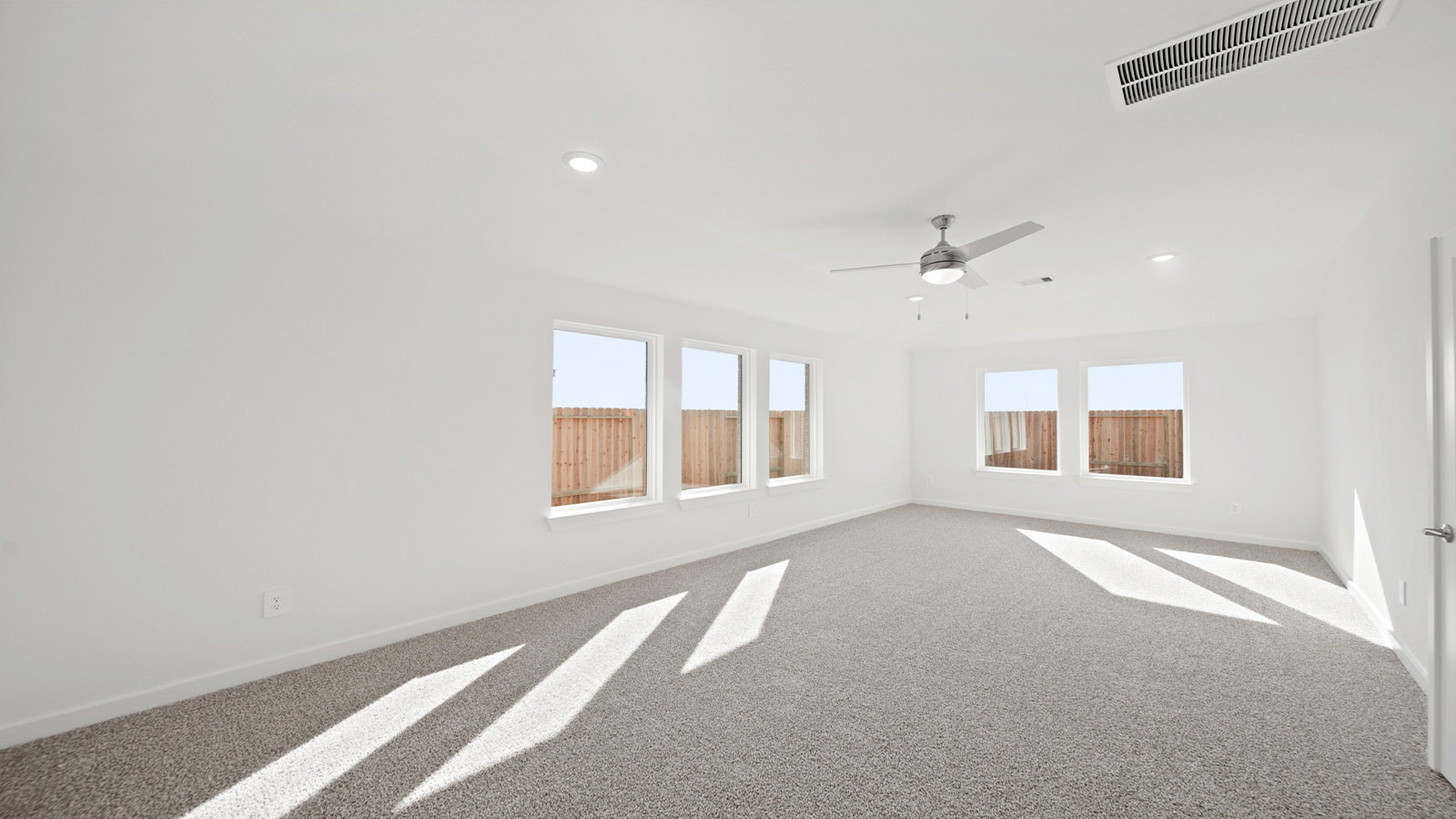 Primary bedroom with carpet flooring