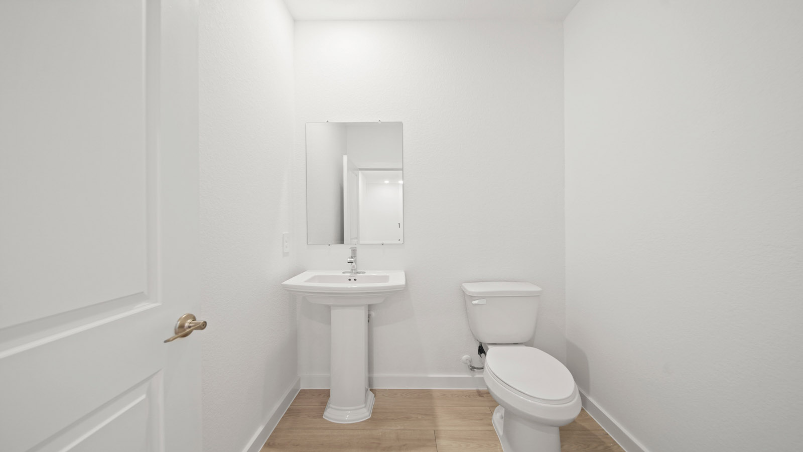 Powder bathroom with pedestal sink