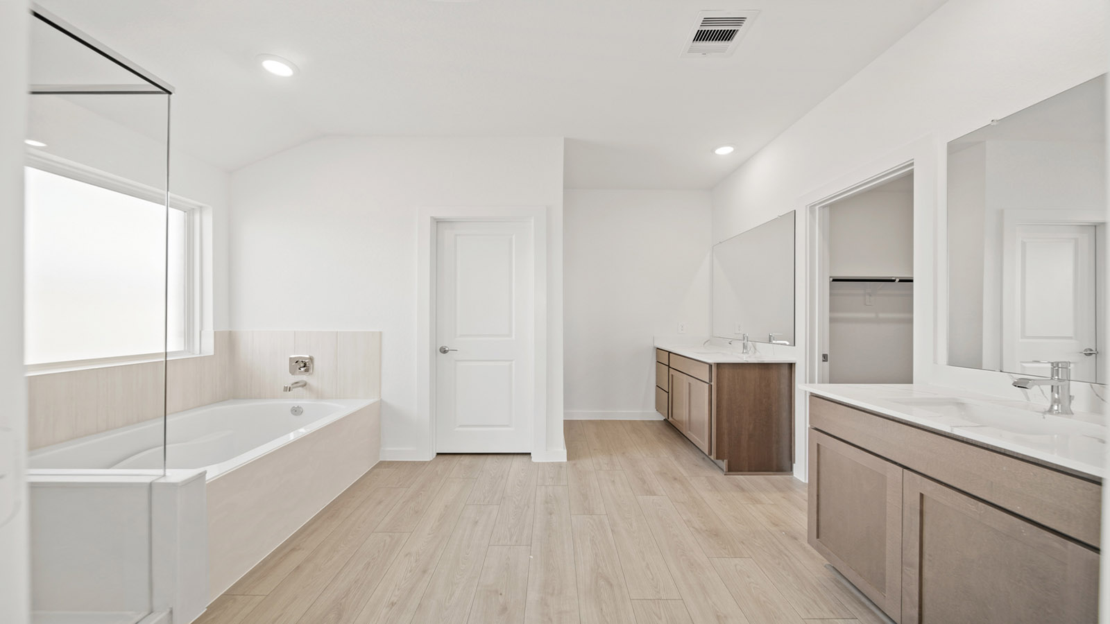 Primary bathroom with tub and shower