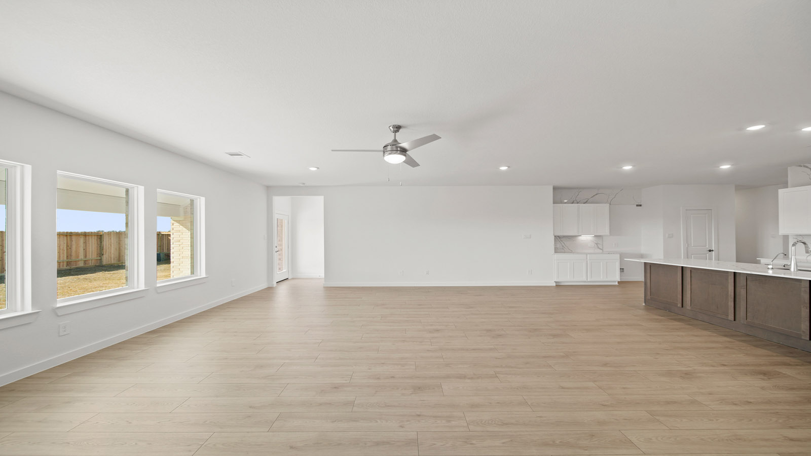 Open concept living, dining, and kitchen area