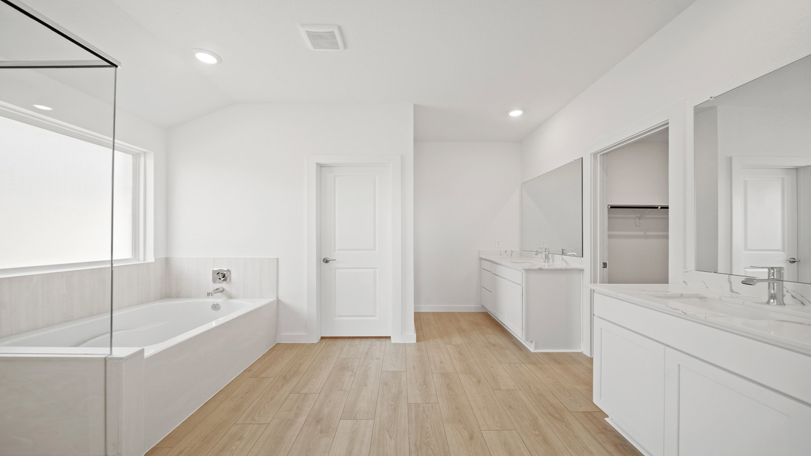 Primary bedroom with bright windows