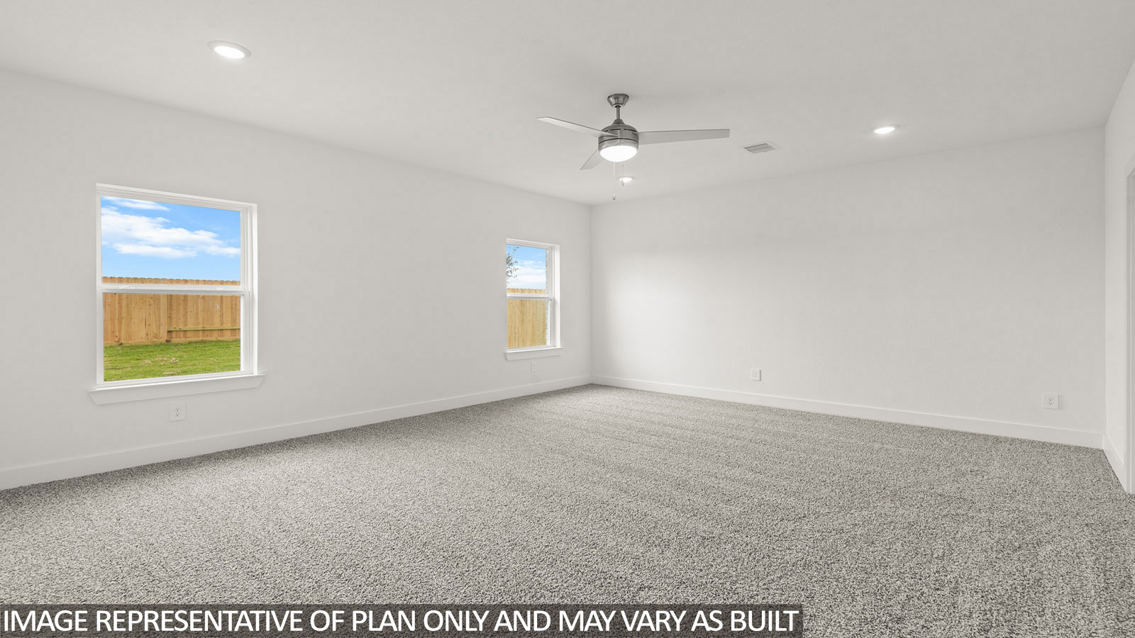 Primary bedroom with bright windows
