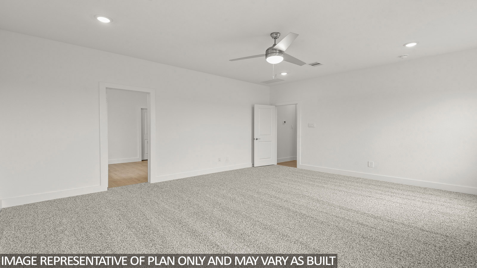 Primary bedroom with carpet flooring