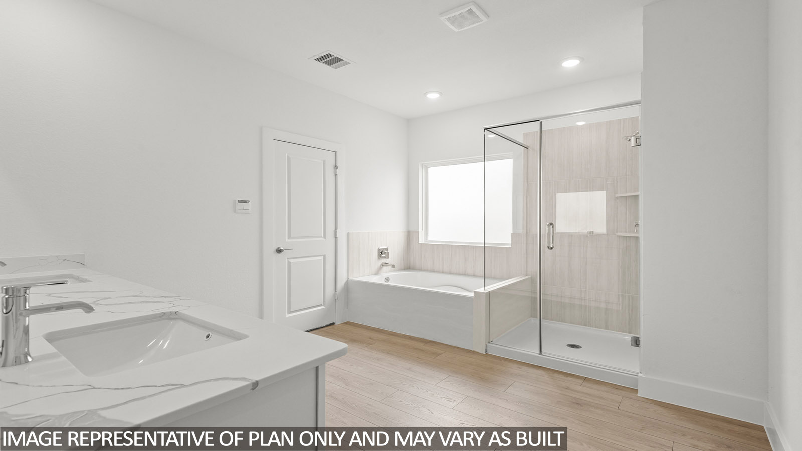 Primary bathroom with tub and shower