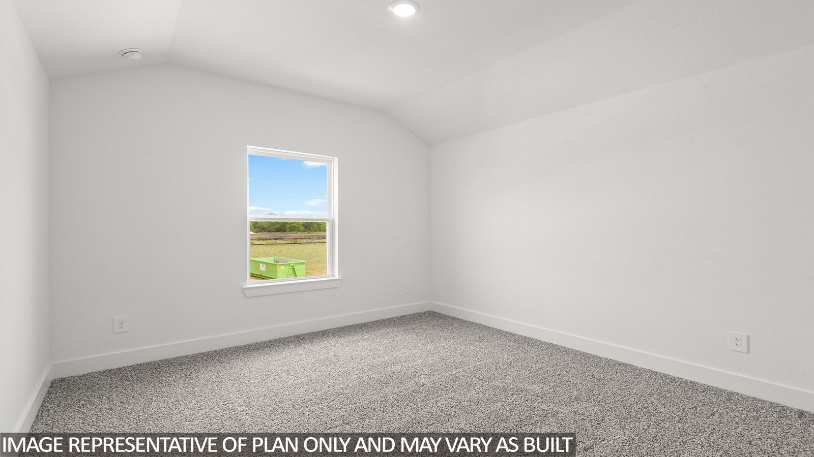 Secondary bedroom with carpet flooring