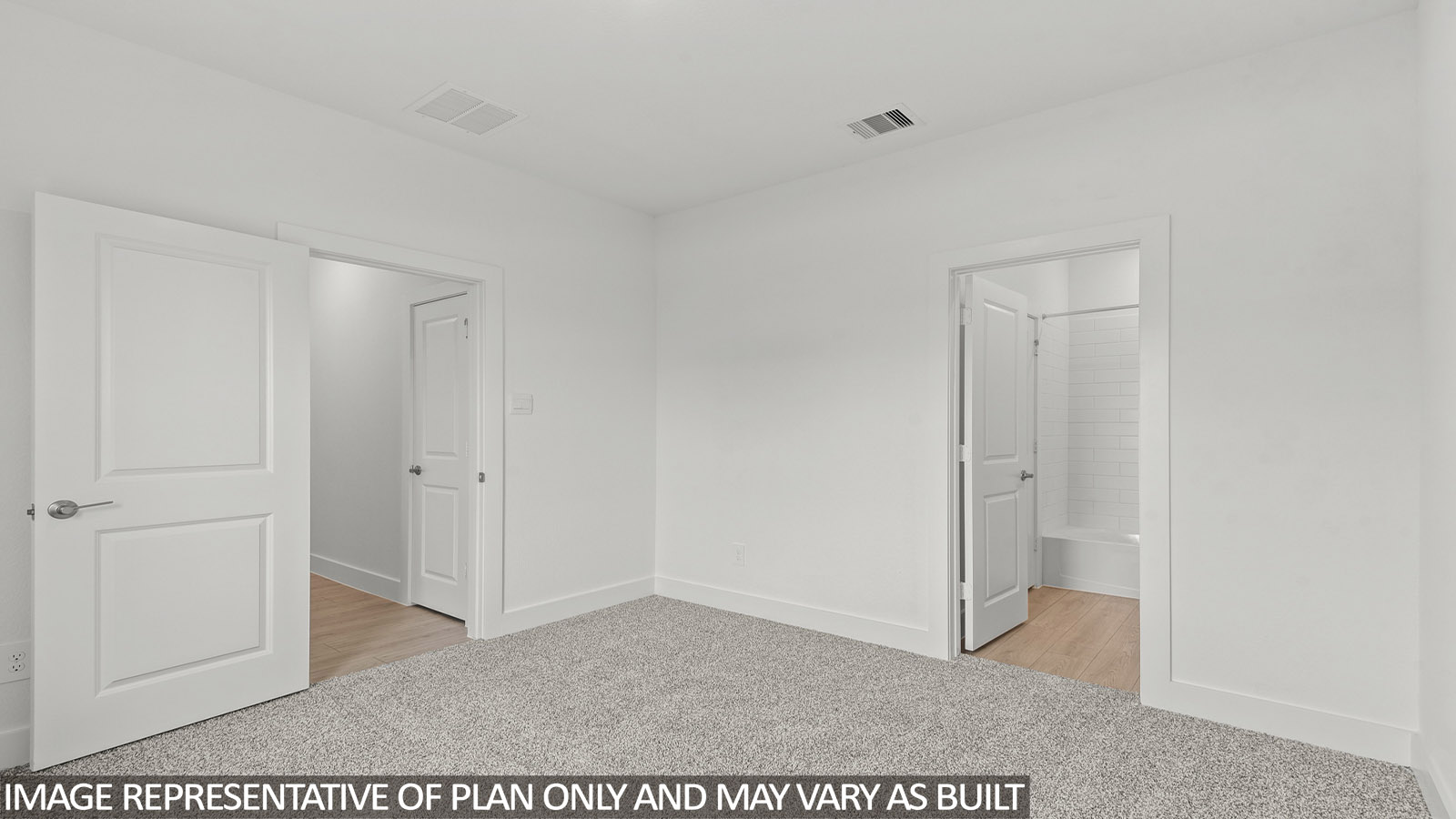 Secondary bedroom with carpet flooring