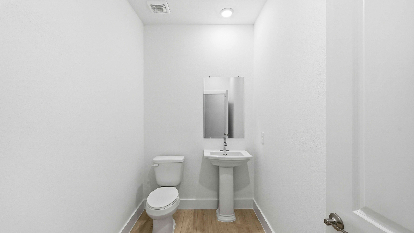 Powder bathroom with pedestal sink