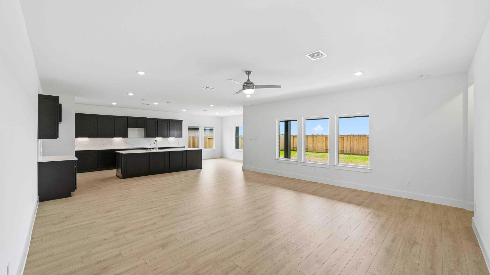 Kitchen with an island and vinyl floor