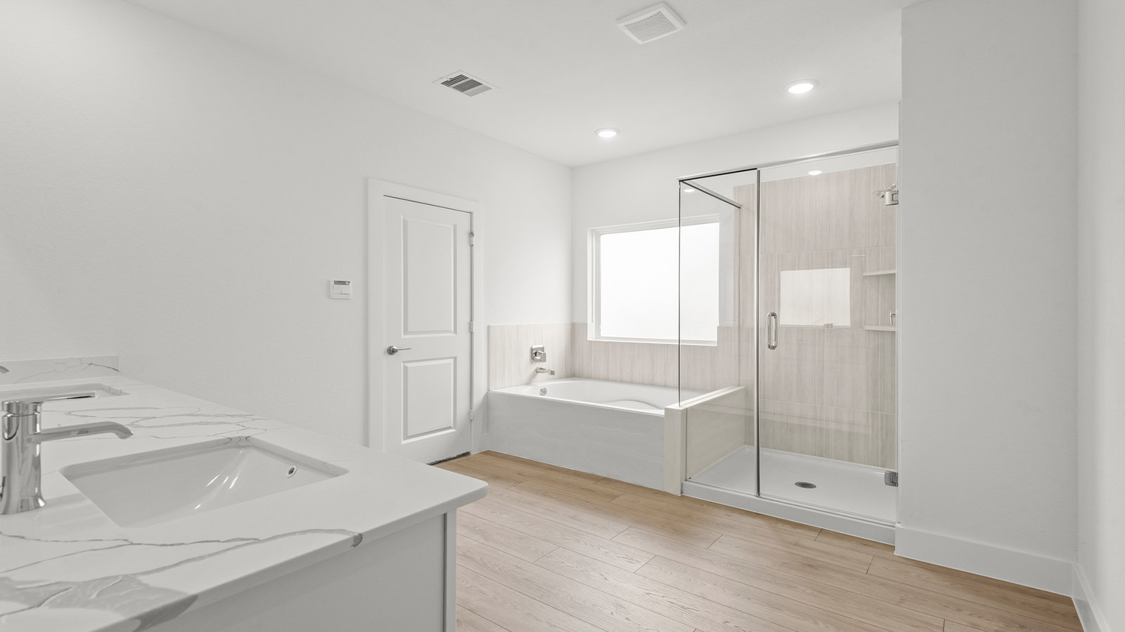 Primary bathroom with tub and shower