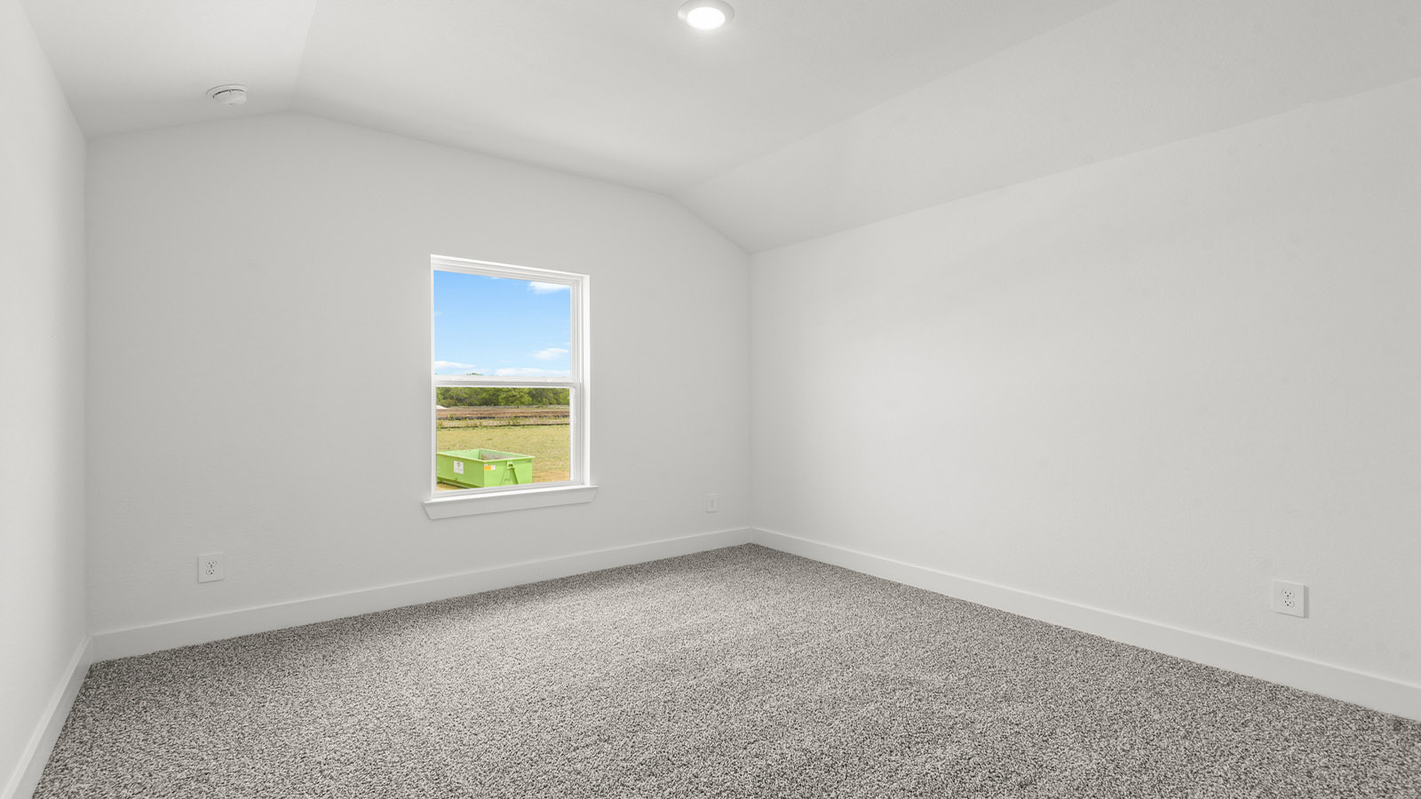 Secondary bedroom with carpet flooring