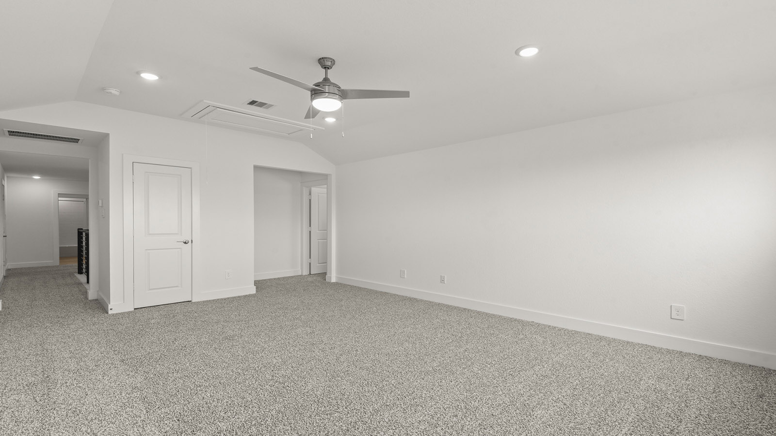 Secondary bedroom with carpet flooring