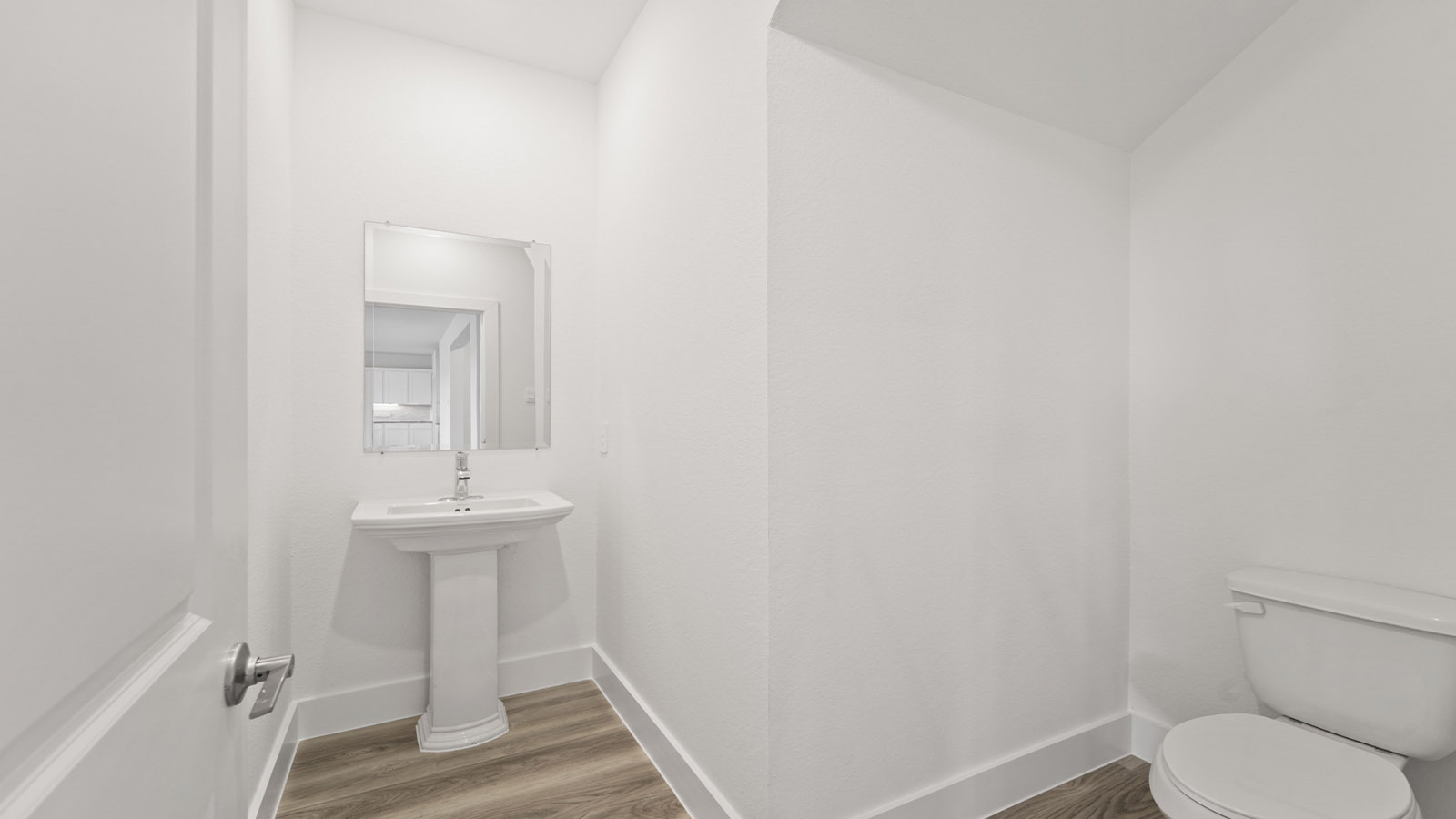 Powder bathroom with pedestal sink
