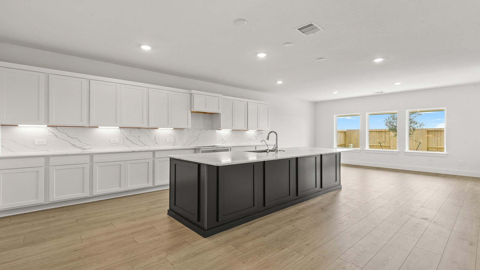 Kitchen with an island and vinyl floor