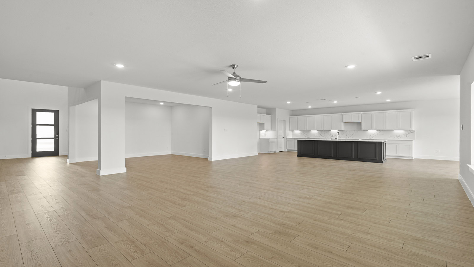 Open concept living, dining, and kitchen area