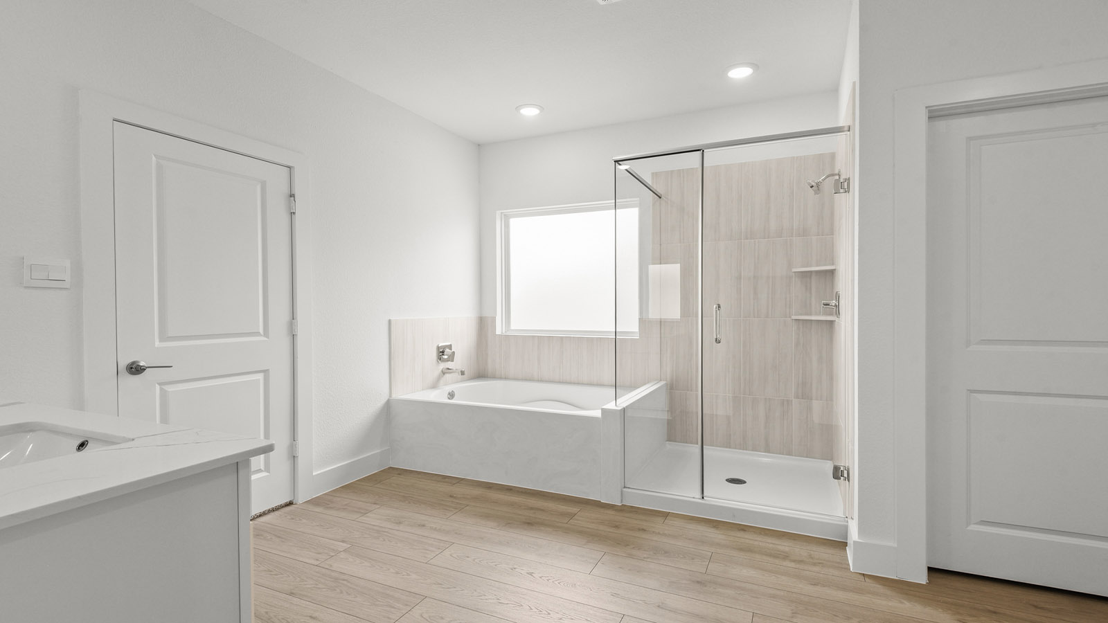 Primary bathroom with tub and shower
