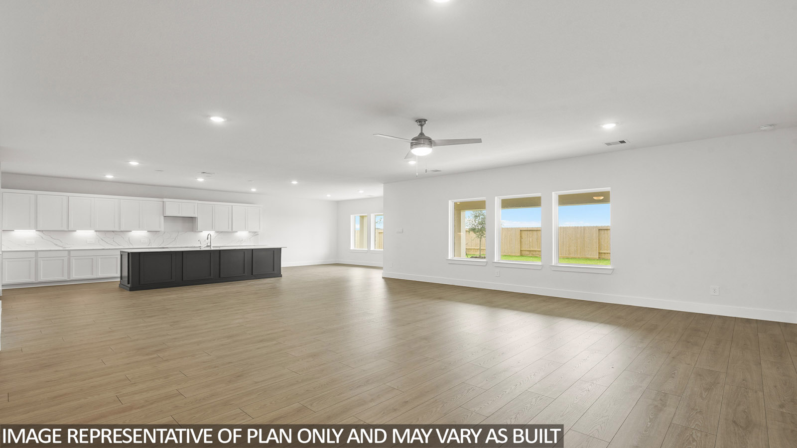 Kitchen with an island and vinyl floor