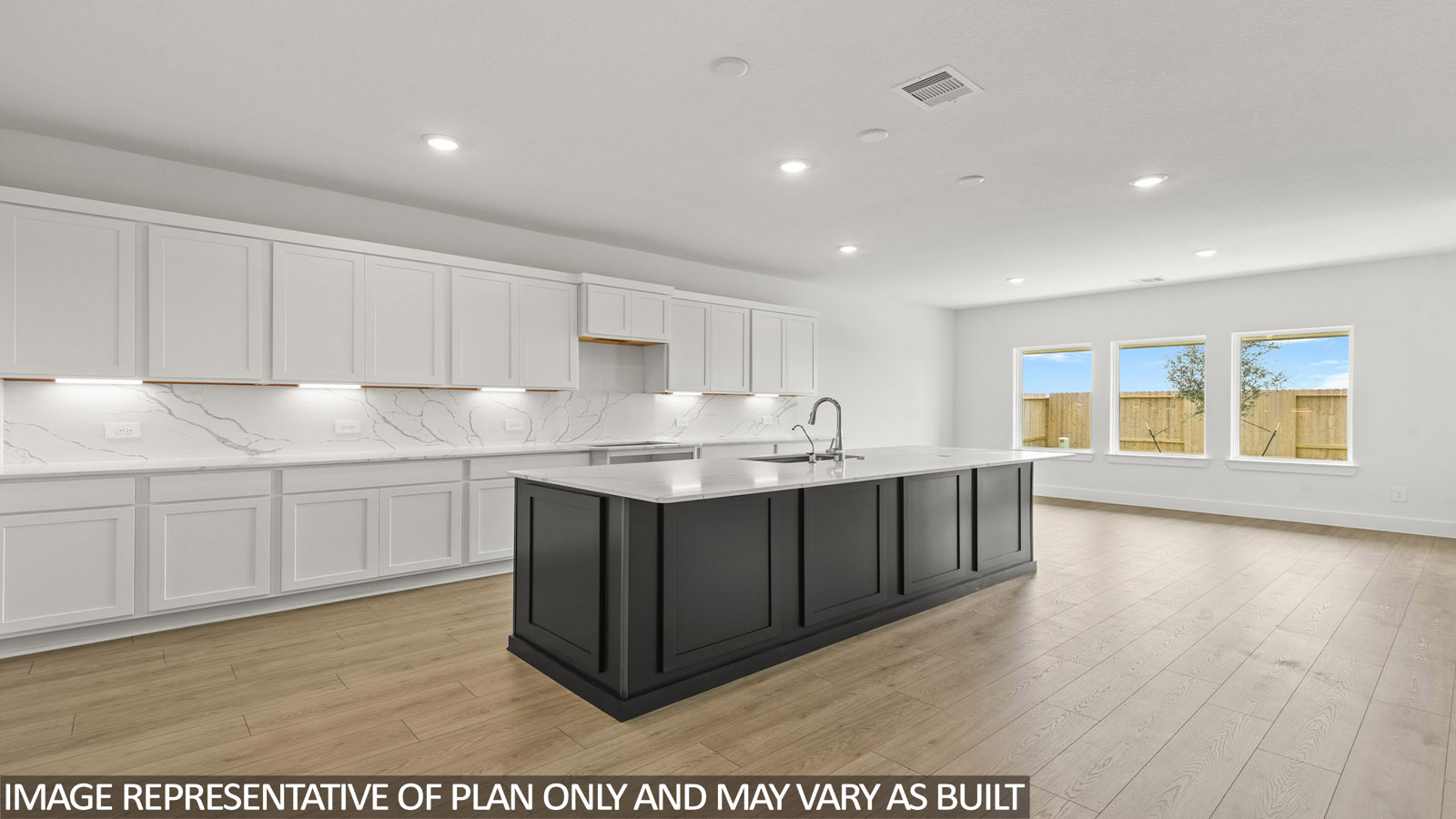Kitchen with an island and vinyl floor