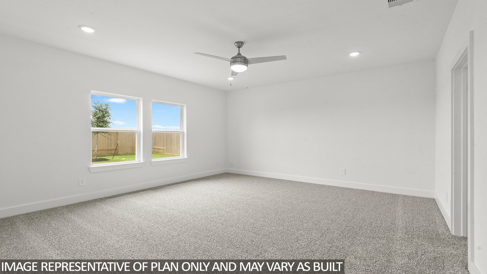 Primary bedroom with bright windows