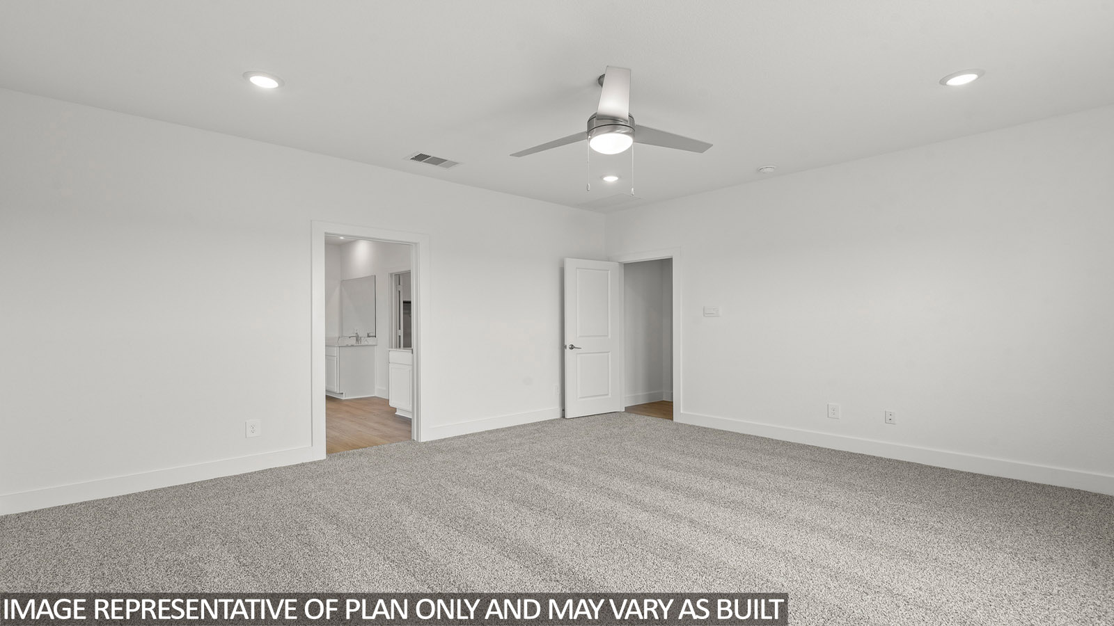 Primary bedroom with carpet flooring