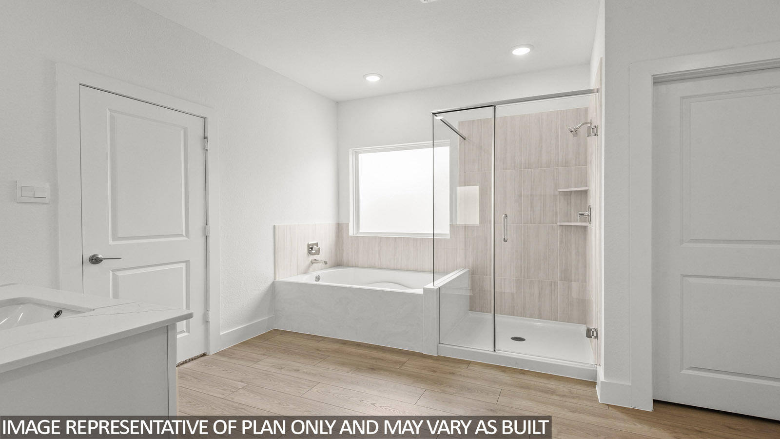 Primary bathroom with tub and shower