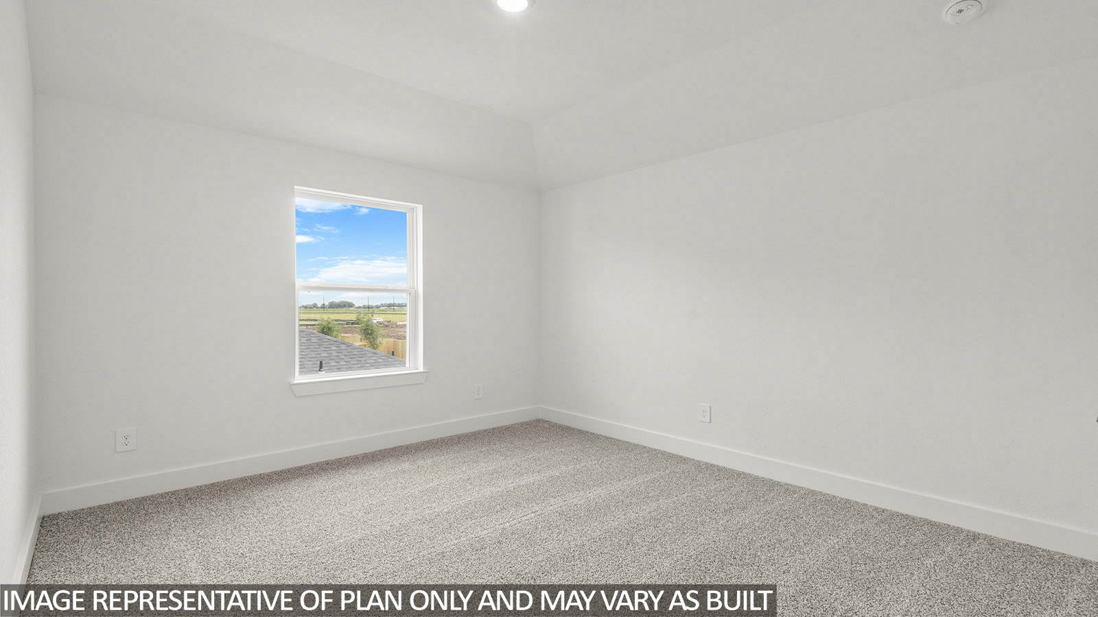 Secondary bedroom with carpet flooring