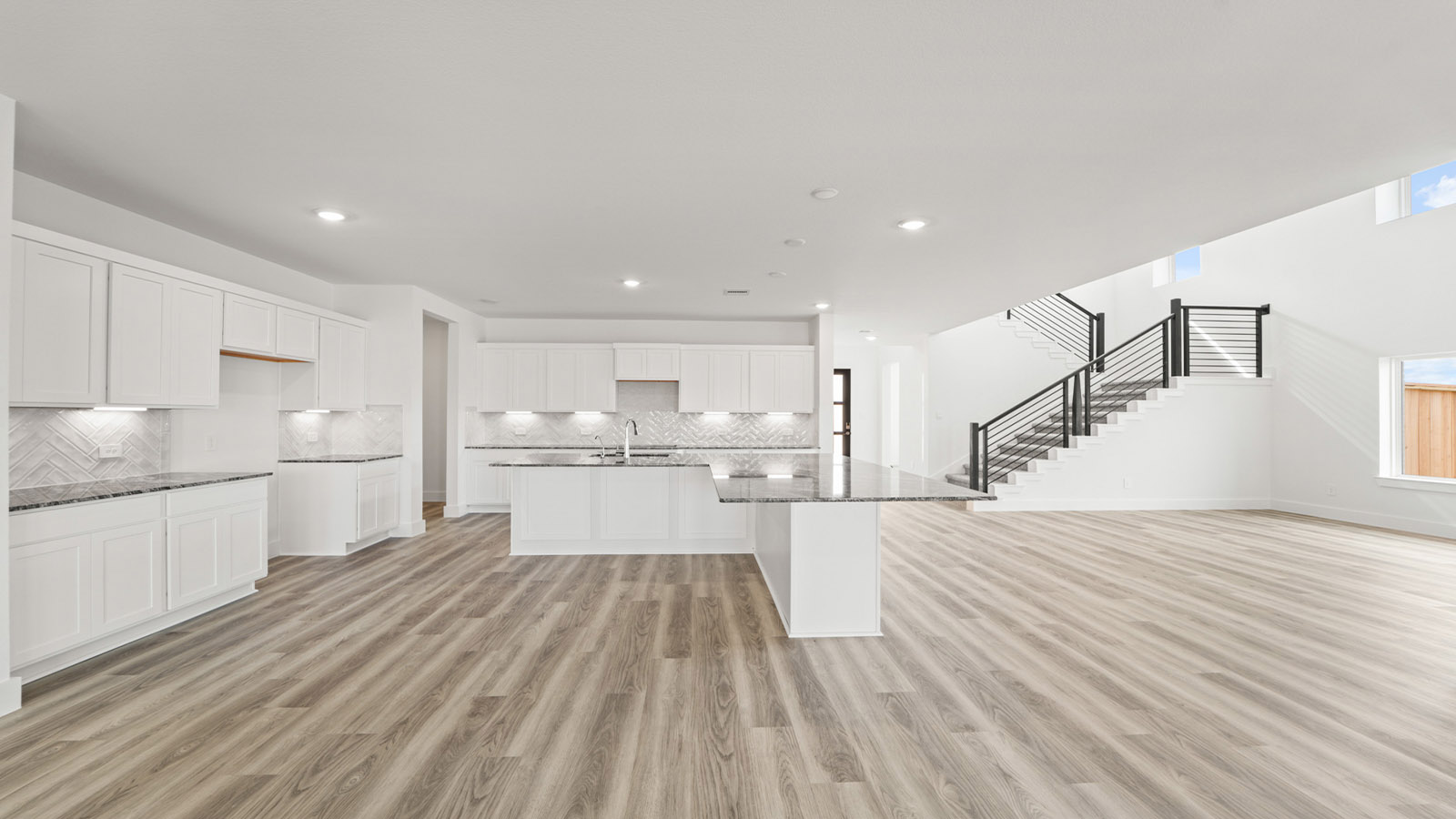 Open concept living, dining, and kitchen area