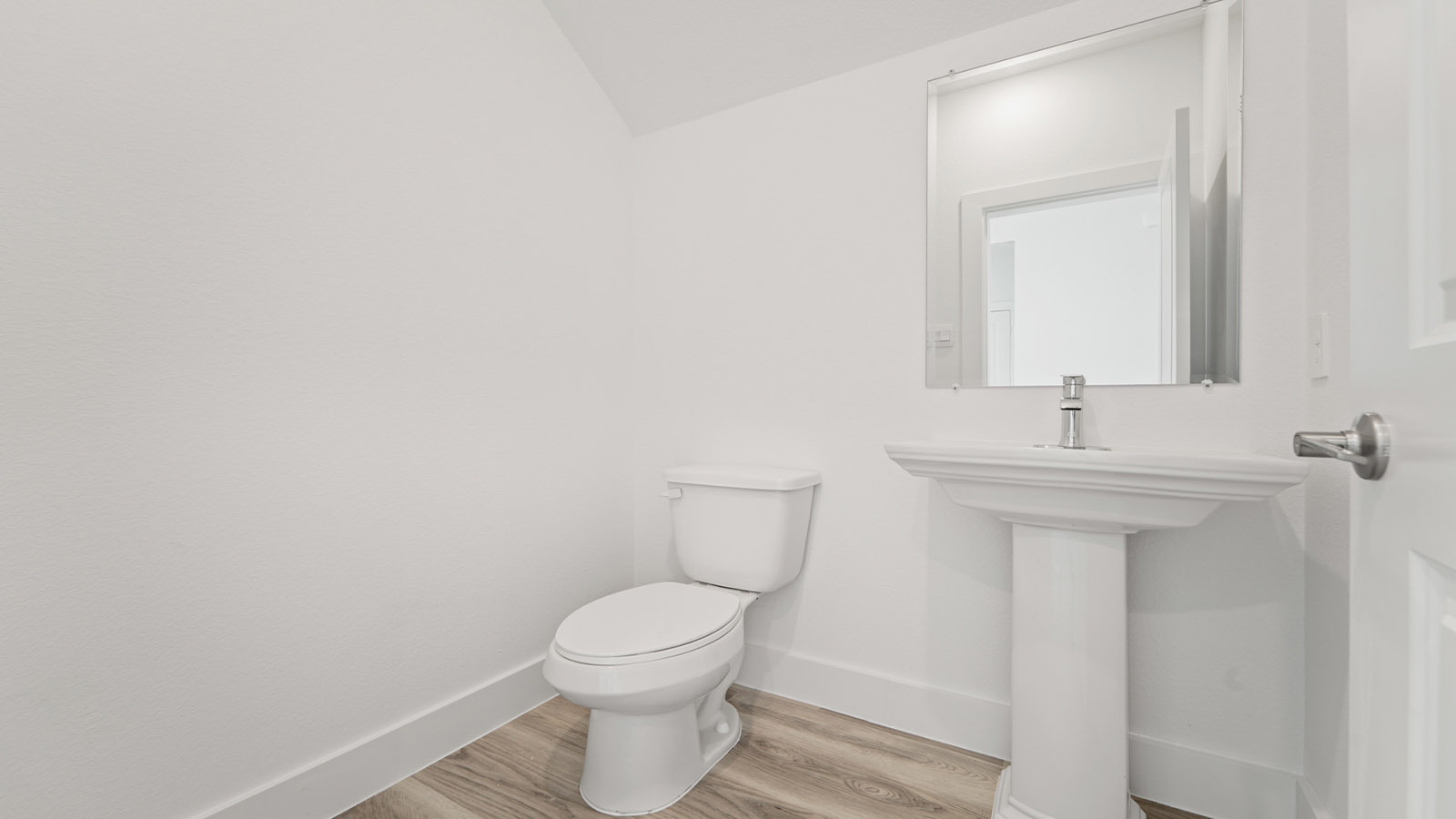 Powder bathroom with pedestal sink