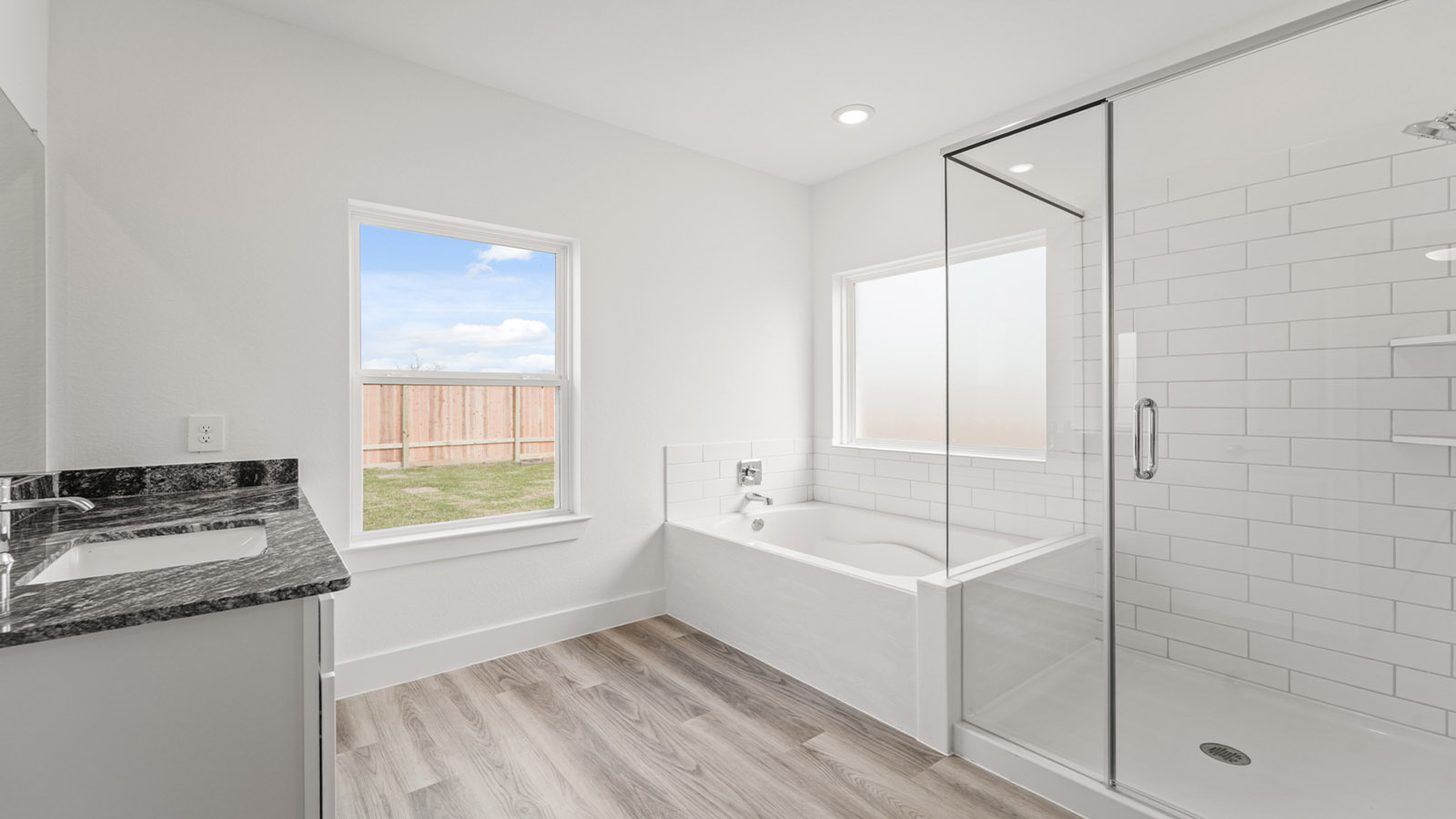 Primary bathroom with tub and shower