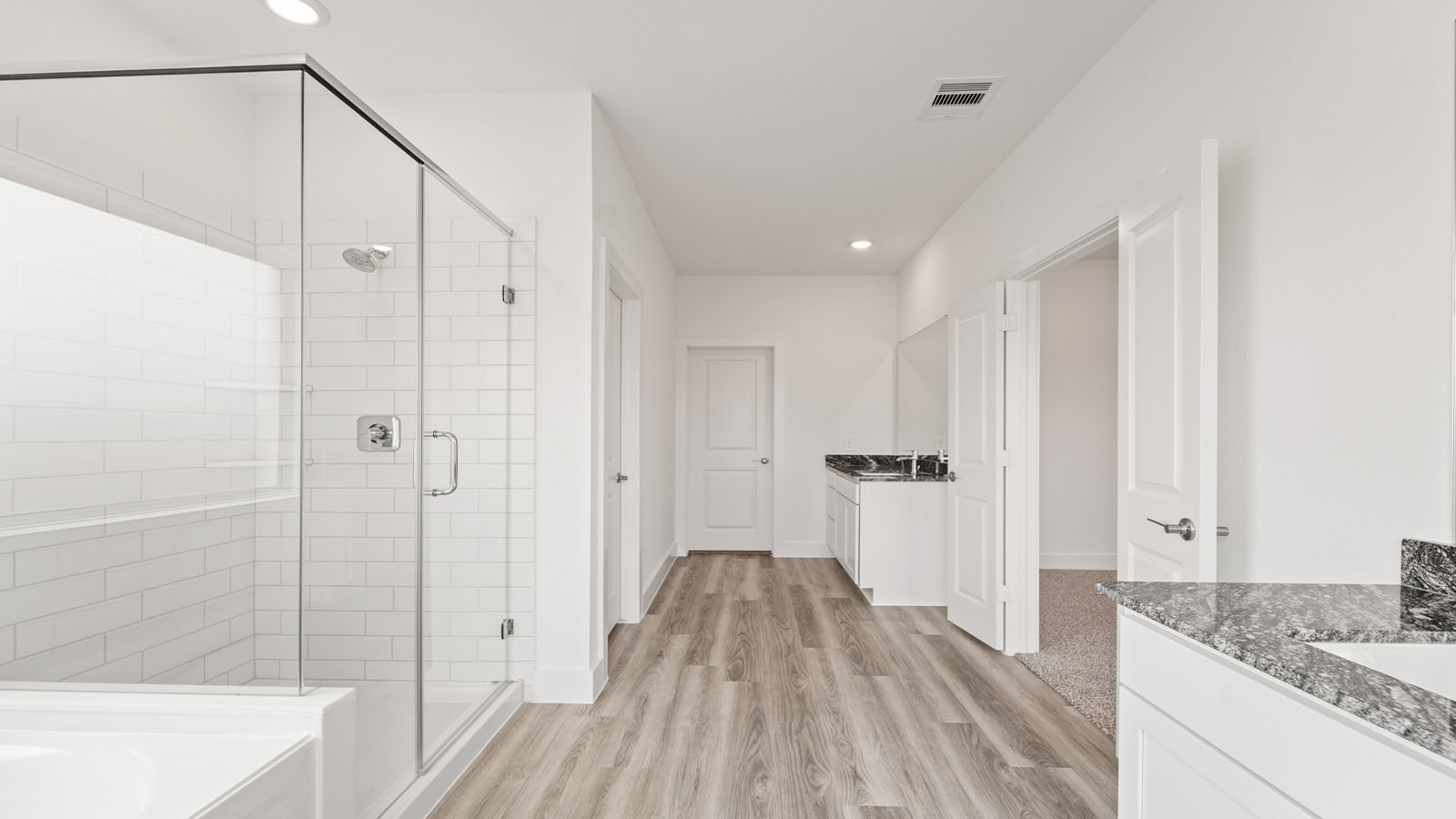 Primary bathroom with tub and shower
