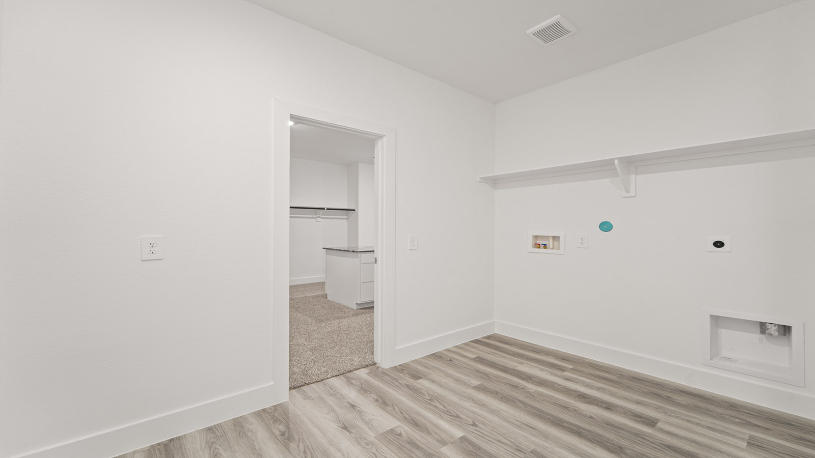 utility room with vinyl flooring