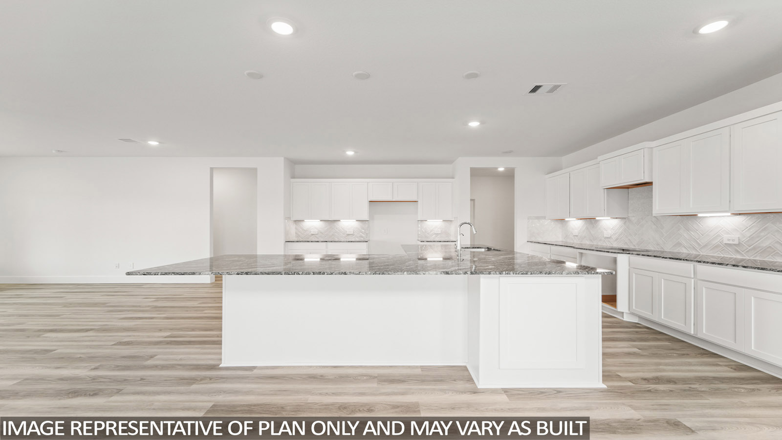 Kitchen with an island and vinyl floor