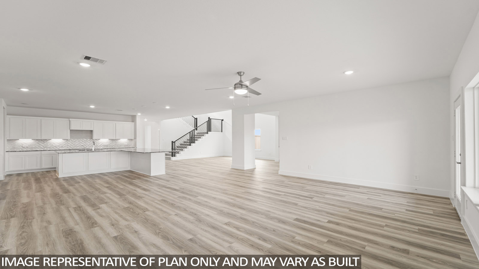 Spacious living area with vinyl flooring