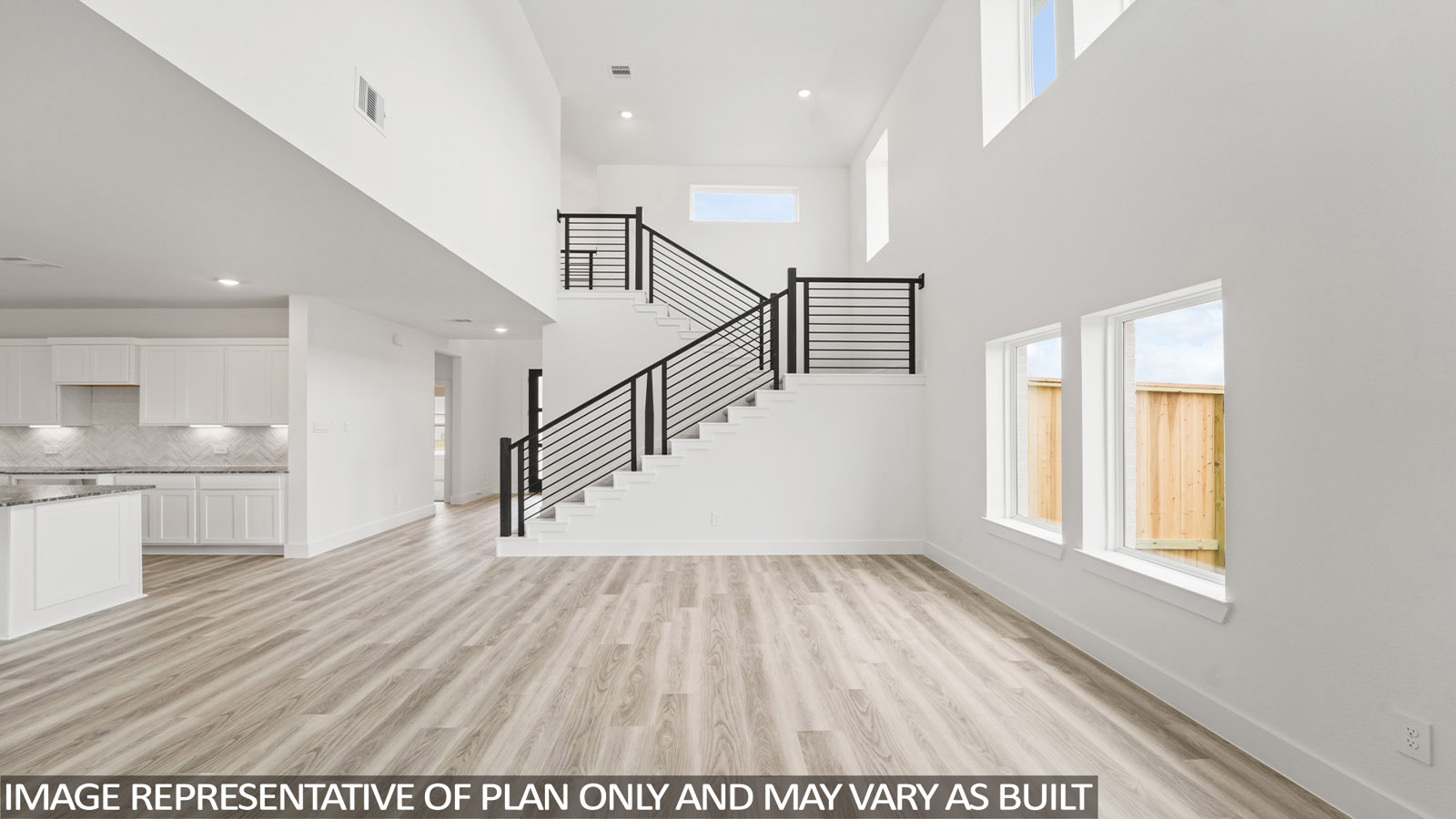 Spacious living area with vinyl flooring