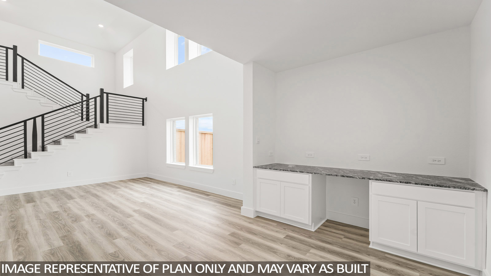 Spacious living area with vinyl flooring