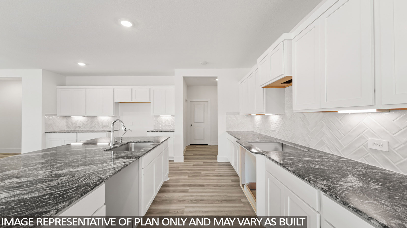 Kitchen with an island and vinyl floor