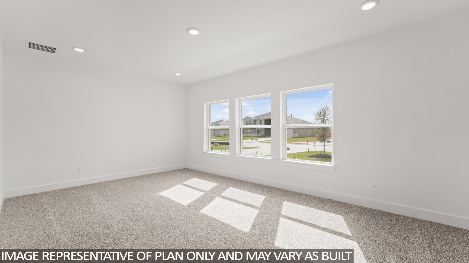 Primary bedroom with bright windows
