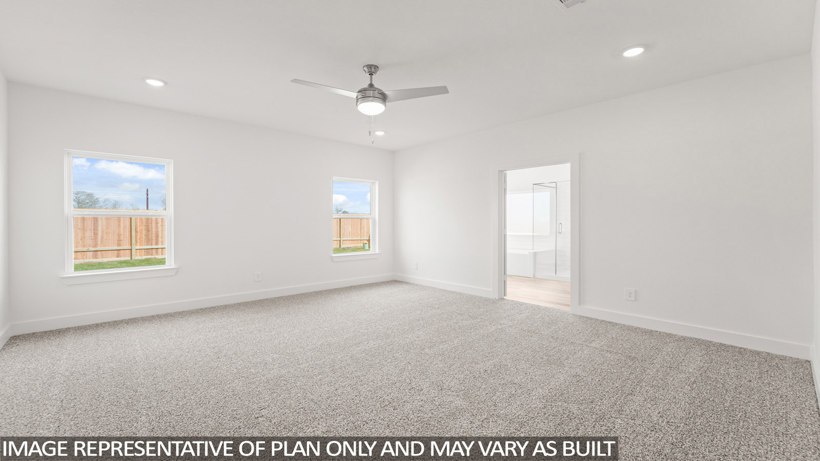 Secondary bedroom with carpet flooring