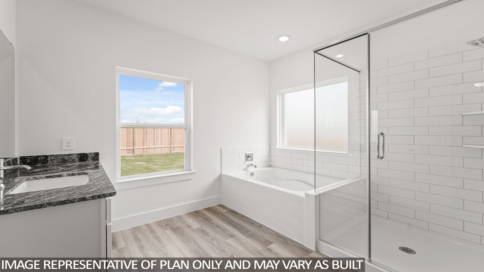 Primary bathroom with tub and shower
