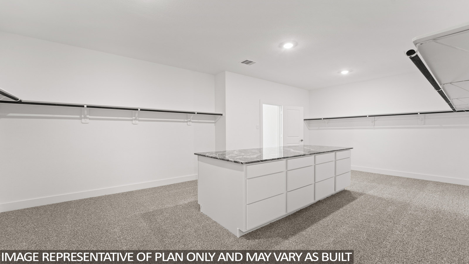 walk in closet with island storage