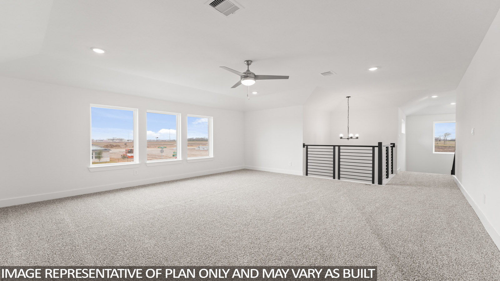 Second story game room with carpet flooring