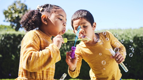 kids blowing bubbles