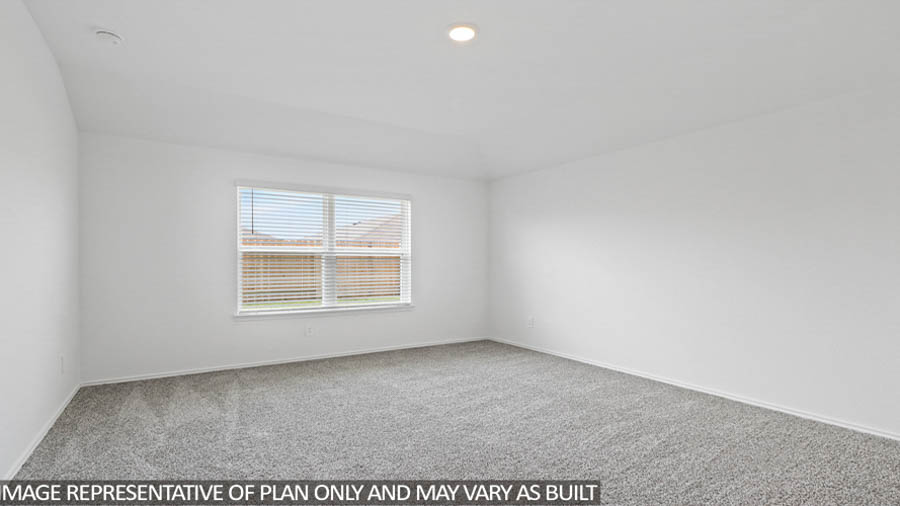 Primary bedroom with carpet flooring